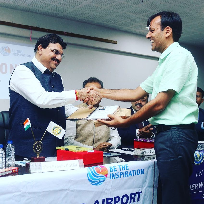 Pravin Kotak receiving recognition at Rotary event